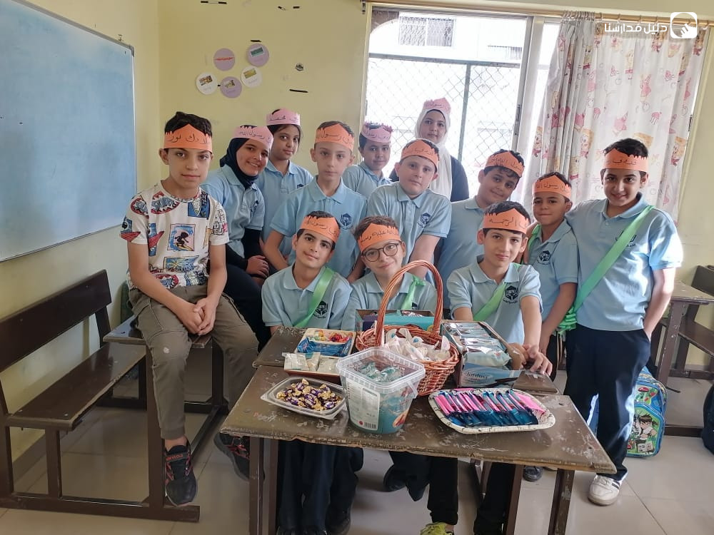 مدارس القادسية slide 2