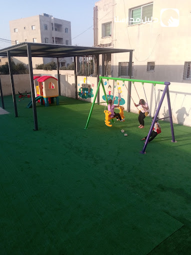 مدرسة وروضة الخزامى slide 5